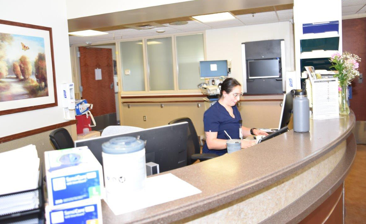 Orthopedics floor front desk with nurse at computer